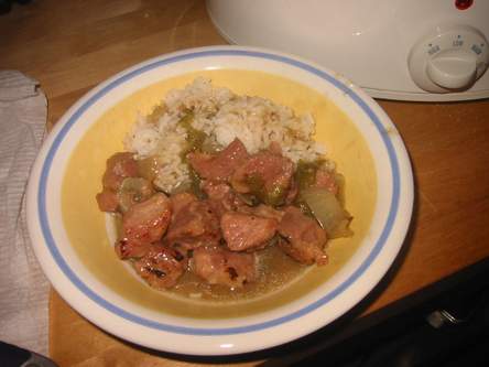 bowl of green chile with a wee bit of arroz blanco
