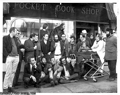 this photo from 1965,
back in the day, as they say:
Upper top row, from left, Stella Levy, Lawrence Ferlinghetti.
Second row, standing: Donald Schenker, Michael Grieg,
unknown person, Mike Gibbons, David Miltger, 
Michael McClure, Allen Ginsberg, Dan Langton, Steve 
Brostan, Gary Goodrow and son Homer, Richard Brautigan
(behind Goodrow, with white hat). Seated: Unknown person,
Shigeyoshi Murao, Lew Welch, Peter Orlovsky,
unidentified man on gurney, bearded man