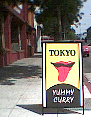 sign in front of downtown Berkeley eatery,
 not sure how yummy their curries be,
but maybe we find out 'fore too long...